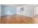 Spacious living room boasting wood floors, ample natural light and potential for a cozy atmosphere at 10784 Allendale Dr, Arvada, CO 80004
