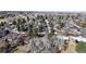 A scenic aerial view of a residential neighborhood with tree-lined streets and well-maintained homes at 178 E 11Th Ave, Broomfield, CO 80020