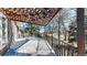 Spacious back deck with steel railings and a partially covered sitting area offers scenic views at 178 E 11Th Ave, Broomfield, CO 80020