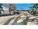 Spacious backyard featuring a red brick home with a balcony and sliding glass doors, perfect for outdoor entertaining at 178 E 11Th Ave, Broomfield, CO 80020