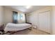 Cozy bedroom featuring built-in closets and neutral carpeting at 178 E 11Th Ave, Broomfield, CO 80020
