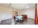 Charming dining room with stone floors, a chandelier, and view into the kitchen at 178 E 11Th Ave, Broomfield, CO 80020