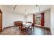 Charming dining room featuring stone floors, chandelier, and natural light at 178 E 11Th Ave, Broomfield, CO 80020