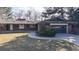 Beautiful brick home with a well-kept lawn, an attached garage, and a charming front yard landscape at 178 E 11Th Ave, Broomfield, CO 80020