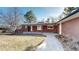 Charming brick home featuring a covered front patio and a well-manicured lawn leading to a welcoming entrance at 178 E 11Th Ave, Broomfield, CO 80020