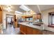 Spacious kitchen with wooden cabinets, modern appliances, kitchen island, and a large skylight at 178 E 11Th Ave, Broomfield, CO 80020