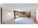 Bright living room with carpet, stairs and large window with patterned drapes at 178 E 11Th Ave, Broomfield, CO 80020