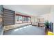 Bright living room featuring large windows offering ample natural light and a built-in bookshelf at 178 E 11Th Ave, Broomfield, CO 80020