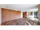 Open living area showcasing brick accent wall and tiled floors that transition into a separate seating area at 178 E 11Th Ave, Broomfield, CO 80020