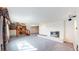 Spacious living room featuring a brick fireplace and staircase at 178 E 11Th Ave, Broomfield, CO 80020