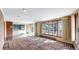 Inviting living room showcasing expansive windows with views and a tiled entryway to a balcony at 178 E 11Th Ave, Broomfield, CO 80020