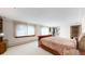 The main bedroom features a sleek bed, large windows, and plush carpeting at 178 E 11Th Ave, Broomfield, CO 80020