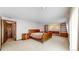 Spacious primary bedroom with carpet, bedside tables, and walk-in closet at 178 E 11Th Ave, Broomfield, CO 80020