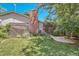 Private backyard with a brick chimney and lattice fence, perfect for outdoor enjoyment at 10158 E Fair Cir, Englewood, CO 80111