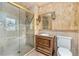 Lavish bathroom featuring glass shower with mosaic tile and ornate vanity at 10158 E Fair Cir, Englewood, CO 80111