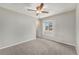 Neutral bedroom features carpet, a ceiling fan, closet and a window at 10158 E Fair Cir, Englewood, CO 80111