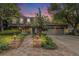 Charming home with a brick pathway lined with landscaping at 10158 E Fair Cir, Englewood, CO 80111