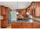 Stylish kitchen with island, custom cabinetry and stainless-steel appliances at 10158 E Fair Cir, Englewood, CO 80111