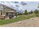 Spacious backyard featuring covered gazebo, patio with hot tub, and landscaped yard at 11895 Hitching Post Ct, Parker, CO 80134