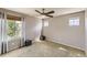 Well-lit bedroom with neutral walls, carpet, ceiling fan and three windows at 11895 Hitching Post Ct, Parker, CO 80134