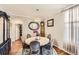 Elegant dining room with a round table, seating for six, and refined decor at 11895 Hitching Post Ct, Parker, CO 80134