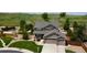 Charming two-story home features a spacious two car garage and beautiful landscaping with a fenced backyard at 11895 Hitching Post Ct, Parker, CO 80134