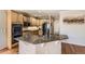Spacious kitchen with wooden cabinetry, granite countertops, and stainless steel appliances at 11895 Hitching Post Ct, Parker, CO 80134