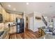 Well-appointed kitchen with wooden cabinets, granite countertops, and stainless steel refrigerator at 11895 Hitching Post Ct, Parker, CO 80134
