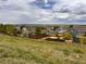 Scenic neighborhood view featuring well-maintained homes, mature trees, and lush greenery at 11895 Hitching Post Ct, Parker, CO 80134
