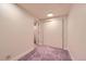 Basement room with carpet, and access to a small bathroom through an open door at 7166 Newhall Dr, Highlands Ranch, CO 80130
