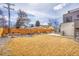 Large backyard featuring a patio with outdoor seating, a grill, and a well-maintained lawn at 3910 Reed St, Wheat Ridge, CO 80033