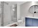 Modern bathroom featuring a glass-enclosed shower, updated vanity, and stylish fixtures at 3910 Reed St, Wheat Ridge, CO 80033