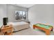 Cozy bedroom featuring a bright window, neutral carpeting, and ample space for relaxation and play at 3910 Reed St, Wheat Ridge, CO 80033