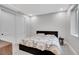 Cozy bedroom with plush carpet, double door closet, and a comfortable bed at 3910 Reed St, Wheat Ridge, CO 80033