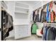 Organized walk-in closet featuring built-in shelving and hanging rods for clothing storage at 3910 Reed St, Wheat Ridge, CO 80033
