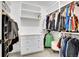 Neatly organized walk-in closet with white shelving and drawers, providing efficient storage solutions at 3910 Reed St, Wheat Ridge, CO 80033