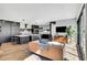 Open-concept living space with a modern fireplace, large sliding doors, and stylish furniture at 3910 Reed St, Wheat Ridge, CO 80033