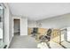 Bright sitting area with comfortable chairs, wood railing and neutral color palette at 3910 Reed St, Wheat Ridge, CO 80033