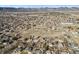 Wide aerial view of the neighborhood and its location with mountains in the distance at 7770 S Estes St, Littleton, CO 80128