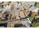 Aerial view of a fenced backyard with a shed, a playground, and an RV at 7770 S Estes St, Littleton, CO 80128