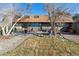 Enjoy outdoor living on the patio with a grill, fire pit, and seating, great for relaxing and entertaining at 7770 S Estes St, Littleton, CO 80128