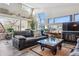 Inviting living room with a fireplace, natural lighting, and stylish furniture at 7770 S Estes St, Littleton, CO 80128
