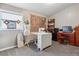 Bright office space with sewing table, wooden desk, vintage map, and stylish accents at 7770 S Estes St, Littleton, CO 80128