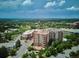 High-angle view of the building showcasing its architecture and community in a scenic, residential area at 4875 S Monaco St # 303, Denver, CO 80237