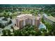 Scenic aerial view of the building surrounded by lush green trees and open green spaces at 4875 S Monaco St # 303, Denver, CO 80237
