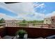 Relaxing outdoor balcony with a beautiful neighborhood view and cozy seating area at 4875 S Monaco St # 303, Denver, CO 80237