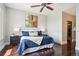 Comfortable bedroom includes hardwood floors, bright windows, and ample closet space at 4875 S Monaco St # 303, Denver, CO 80237