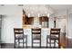 Charming kitchen with stainless steel appliances and eat-in breakfast bar with hardwood floors at 4875 S Monaco St # 303, Denver, CO 80237