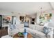 Spacious living room features hardwood floors, modern lighting, and an open floor plan at 4875 S Monaco St # 303, Denver, CO 80237