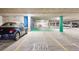 Well-maintained parking garage with clearly marked spaces and efficient layout for convenient parking at 4875 S Monaco St # 303, Denver, CO 80237
